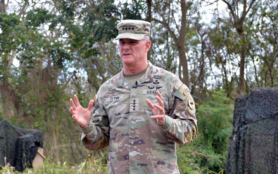 Gen. Charles Flynn, commander of U.S. Army Pacific, speaks to reporters on a training field at Wheeler Army Airfield, Hawaii, Monday, Nov. 6, 2023.