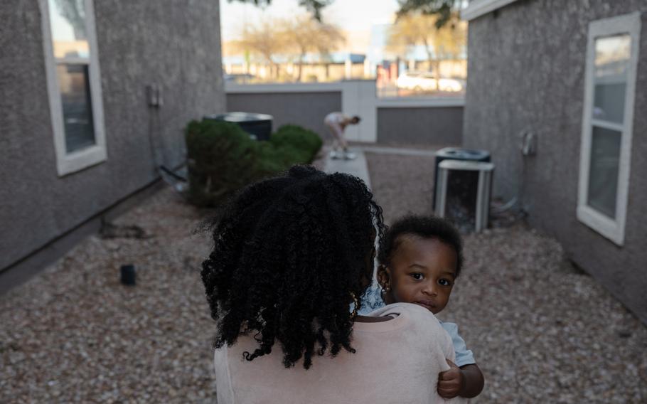 Kiara Age carries her son Kobe Jones, 1, around her apartment complex in Las Vegas. Age was notified the rent of her two bedroom apartment would increase over 20%, she now struggles to find affordable housing in Las Vegas's rental market. 