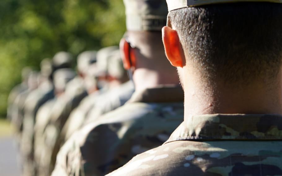 Soldiers stand in formation before a training event at Fort Knox, Ky., Sept. 9, 2021. The Army can now opt to allow enlisted soldiers with 20 or more years of service who are facing separation for misconduct to retire at lower rank, according to new service policy.