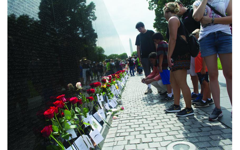 Washington, D.C., June 17, 2018: Flowers line the wall at the Vietnam Veterans Memorial Fund’s Annual Father’s Day Rose Remembrance. Each rose color symbolizes something different. Red is for those killed in action. Yellow are for those missing in action. White roses with red tips symbolize In Memory honorees – those Vietnam veterans who died after the war. 3,000 roseswere placed at the wall.