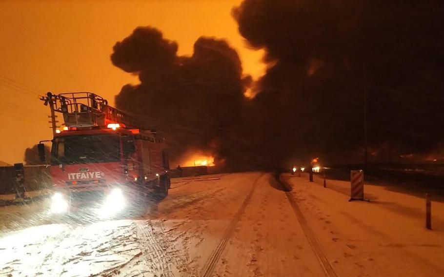 A video screen grab shows smoke rising from an oil pipeline near the town of Pazarcik in the Kahramanmaras province, Turkey, Tuesday, Jan. 18, 2022. 