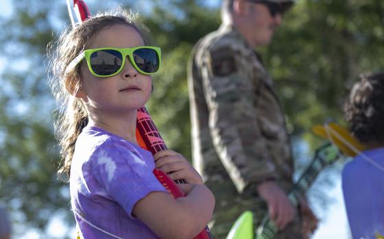 A child wears purple, the color of the Month of the Military Child.