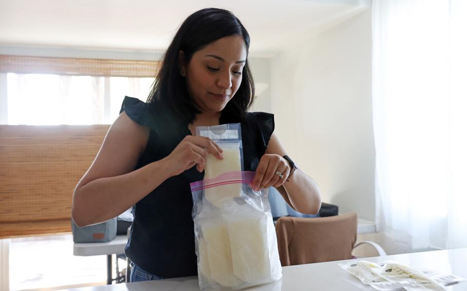 Diana Granados reviews bags of breastmilk she plans to donate at home Wednesday, May 18, 2022, in Baldwin Park, California.