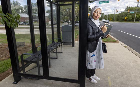 Faleeha Hassan, an award-winning Iraqi poet, has been living in South Jersey as a refugee with her two children for about ten years. Photograph taken the bus stop near her home where she likes to read, Monday, Aug. 8, 2022. (Alejandro A. Alvarez/The Philadelphia Inquirer/TNS)