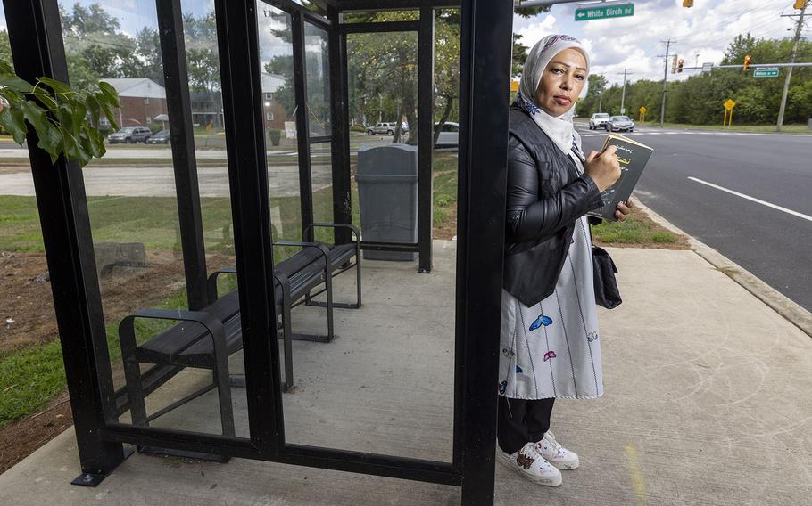 Faleeha Hassan, an award-winning Iraqi poet, has been living in South Jersey as a refugee with her two children for about ten years. Photograph taken the bus stop near her home where she likes to read, Monday, Aug. 8, 2022. 
