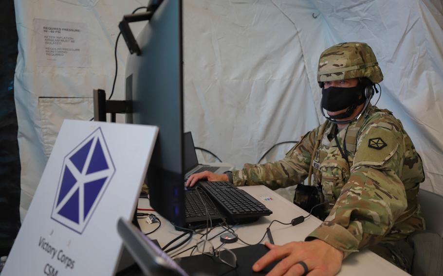 Command Sgt. Maj. Billy Webb is briefed during a V Corps exercise in Grafenwoehr, Germany, on Oct. 4, 2021. The unit, which is the U.S. Army's forward deployed corps in Europe, became fully operational Nov. 3, 2021.