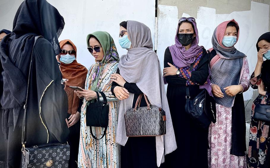 Female protesters gather in downtown Kabul after a brutal Taliban crackdown on demonstrations. After reports that many of the other women who planned to join them had already been detained or beaten by Taliban fighters, the women debated whether to push forward on their own. 