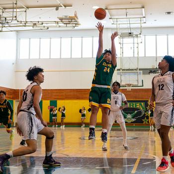 Robert D. Edgren's Jayse Ulechong puts up a shot against Zama.