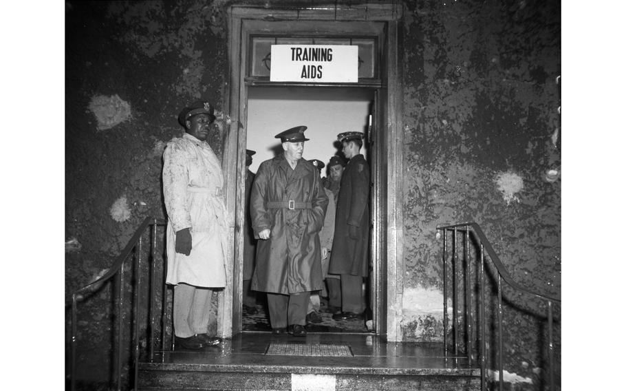 Lt. Gen. Clarence R. Huebner leaves the Training Aids building at the Kitzingen Basic Training Center for Negro troops, the Army’s only experimental school of its kind. The center, which expects to reach full operation by May 1, plans eventually to train every Negro soldier in the EC, as well as any arriving as replacements. 