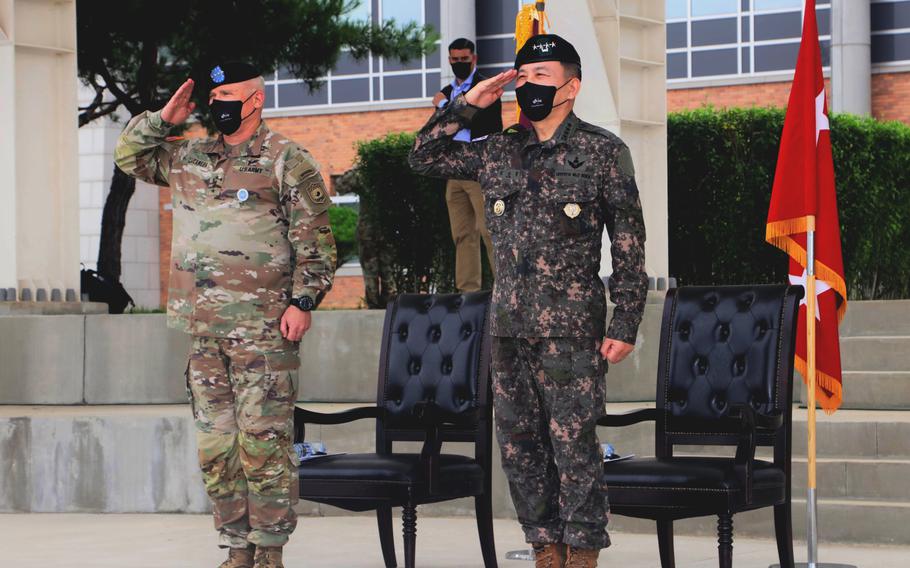 U.S. Forces Korea commander Army Gen. Paul LaCamera, left, and South Korean Gen. Kim Seung-kyum, chairman of the Joint Chiefs of Staff, salute during a welcome ceremony at Camp Humphreys, South Korea, July 12, 2022.