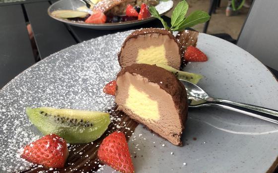 The tartufo classico and apple strudel as served at Degenhardt in Wiesbaden, Germany. The tartufo consisted of a frozen zabaione center surrounded by chocolate cream and cacao powder. The warm strudel came with a scoop of vanilla ice cream and a smattering of fruit.