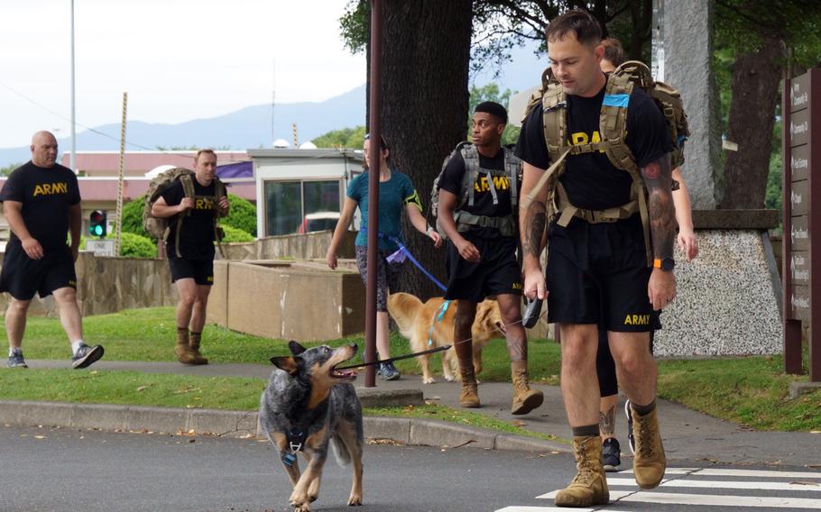 A ruck walk by about 25 soldiers, spouses and some energetic canines marked an opportunity to remember and reflect during Suicide Prevention and Awareness Month at Camp Zama, Japan, Thursday, Sept. 22, 2022.