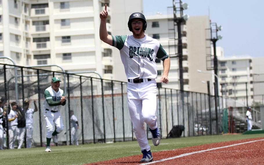 Kubasaki's Lukas Gaines celebrates as he crosses the plate against St. Mary's. 