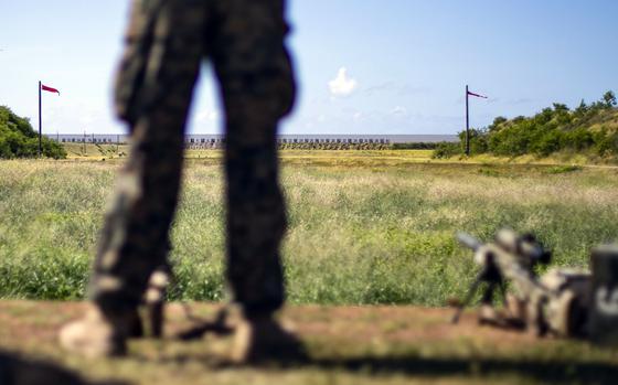 A Marine waits to fire from the 1,000-yard line at the Pu’uloa Range Training Facility, Ewa Beach, Hawaii, Aug. 1, 2019.