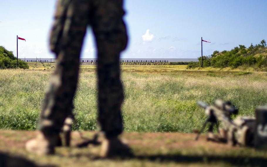 A Marine waits to fire from the 1,000-yard line at the Pu’uloa Range Training Facility, Ewa Beach, Hawaii, Aug. 1, 2019.