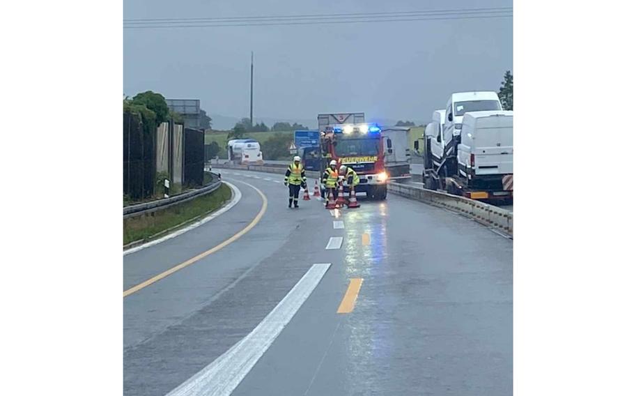 Firefighters open highway A93 near Weiden, Germany, after a military convoy accident closed the road for several hours on Aug. 1, 2023. A 24-year-old soldier died when the armored personnel carrier she was traveling in collided with a civilian semitruck.  
