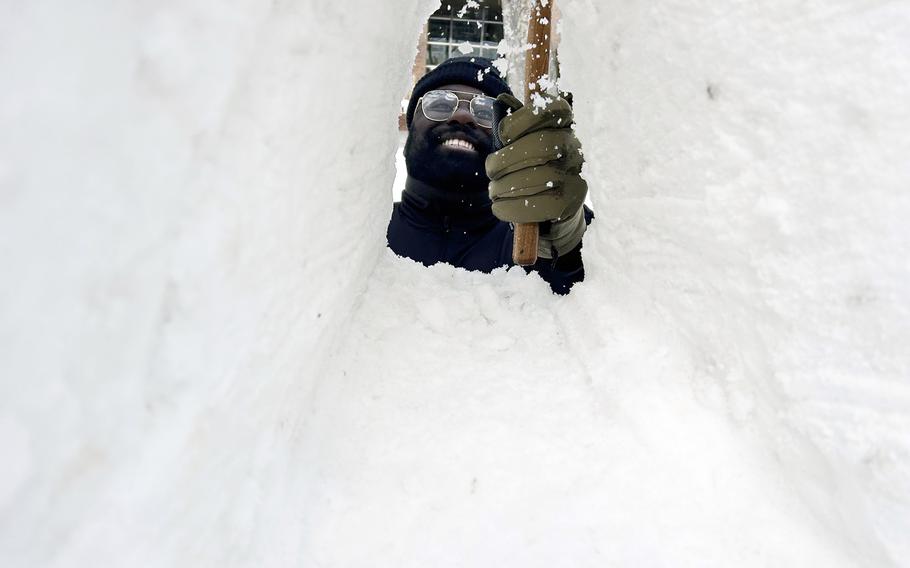 Petty Officer 2nd Class William Brown works on a snow carrier for the Sapporo Snow Festival in Hokkaido, Japan, Jan. 29, 2024. 