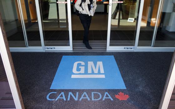A person walks out of the General Motors Co. (GM) Technical Center in Markham, Ontario, Canada, on Friday, June 7, 2019. General Motor's shrinking manufacturing presence is a fundamental shift away from unprofitable car offerings and toward development of advanced driver-assistance technologies. MUST CREDIT: Bloomberg photo by Cole Burston