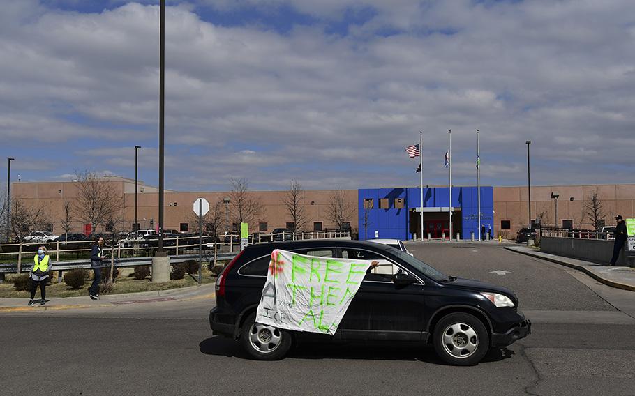 Supporters and family members inside the GEO detention center are in a car caravan to increase the pressure on ICE to release GEO detainees in front of the GEO Aurora ICE Processing Center in Aurora, Colo., on April 9, 2020. 