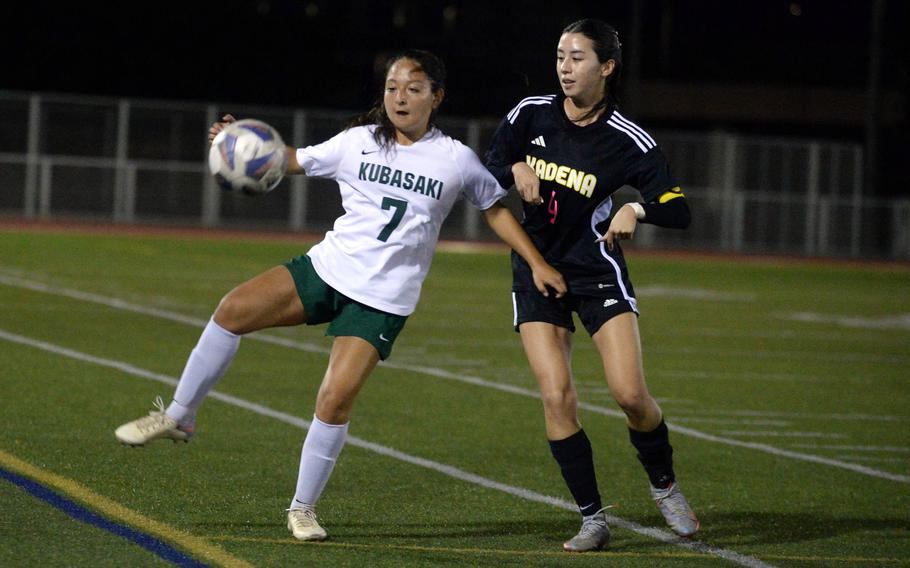 Kubasaki's Mia Lopez tries to settle the ball against Kadena's Yume Catlett during Wednesday's DODEA-Okinawa girls soccer match. The teams played to a 1-1 draw.