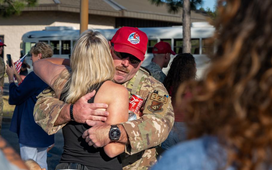 A U.S. Air Force airman assigned to the 823rd Rapid Engineer Deployable Heavy Operational Repair Squadron Engineer reunites with his family at Hurlburt Field, Fla., Sunday, April 14, 2024. 