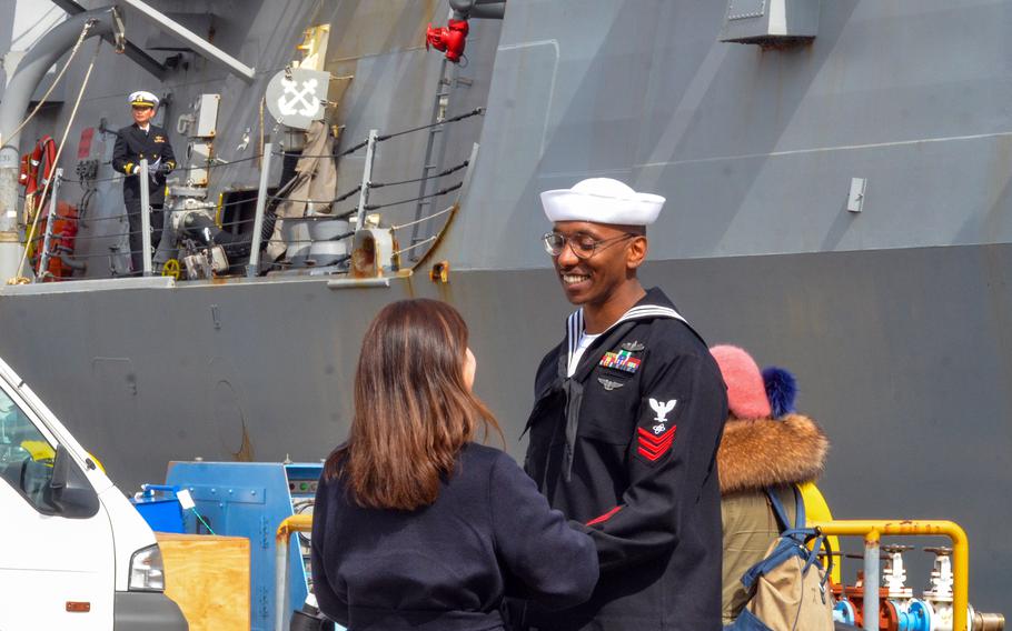 Loved ones reunite as the guided-missile destroyer USS McCampbell returns to Yokosuka Naval Base, Japan, on March 2, 2024.