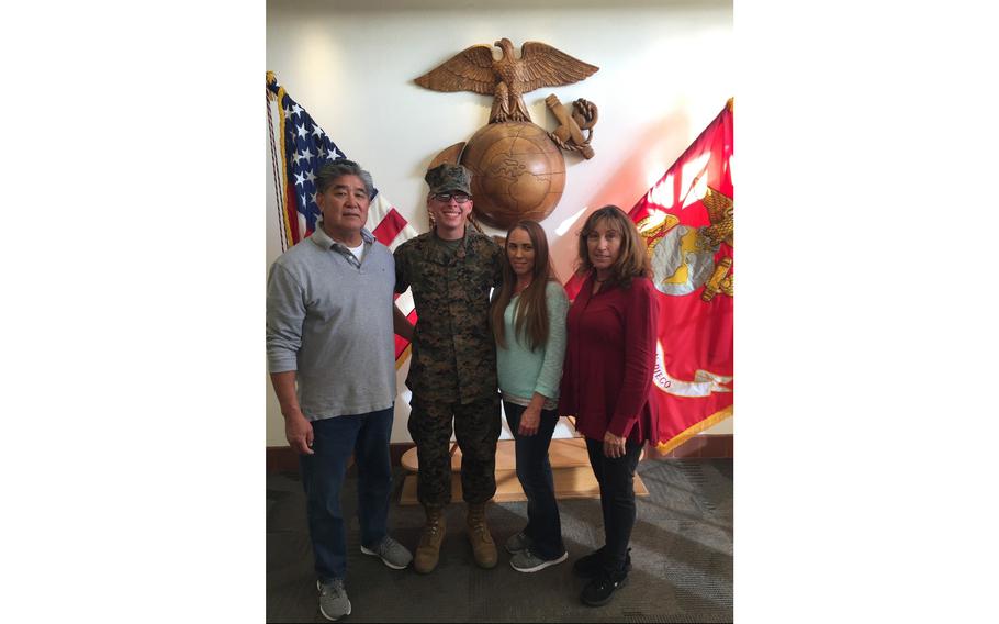 Lance Cpl. Dylan Merola is seen with his mother, Cheryl Rex, and his grandparents, Warren and Clarinda Matsuoka. Merola, 20, was one of the 13 service members killed one year ago as U.S. troops helped refugees leave Afghanistan as the Taliban regained control of the country.