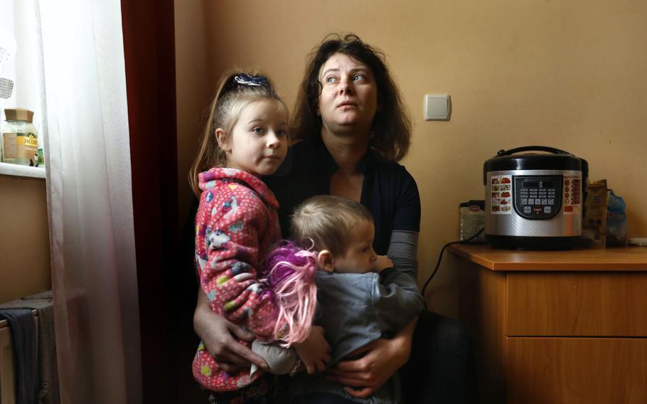 Displaced Ukrainians are living in hotels in and around the city of Lviv on Nov. 26, 2022. The hotels aren’t able to accept as many as they would like because of the lack of electricity. At Helicon Hotel, Olena Chkhvan, age 31, is staying with her eight children, including her son Valentin, age 3, and daughter Milana, age 5, left. They are from Nikopol, Ukraine, and had to leave their home after a missile struck their yard.