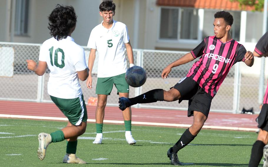 Kadena's Elijah Whipp tries to settle the ball against Kubasaki's Aidan Rodriguez during Wednesday's DODEA-Okinawa boys soccer match. The Panthers won 8-0.