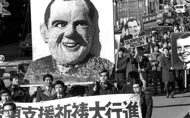 https://www.stripes.com/news/2-000-japanese-christians-march-for-nixon-america-1.24349
Edward Dixon/Stars and Stripes
Tokyo, January, 1974: Hundreds of Japanese Christians bearing signs and a huge effigy of Richard M. Nixon march from Meiji Park to the U.S. Embassy in a show of support for the United States and its beleaguered (by the Watergate scandal) president.
