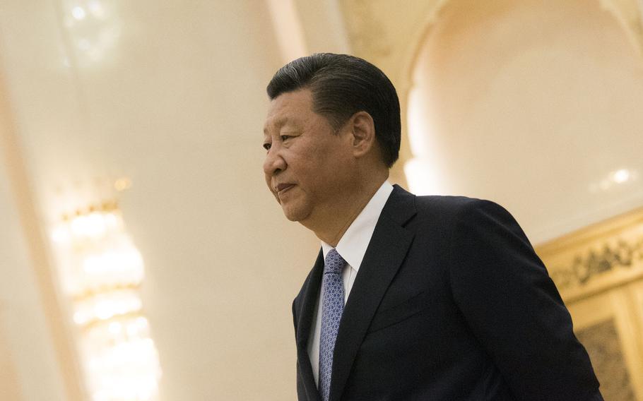 Chinese President Xi Jinping walks through the Great Hall of the People in Beijing, Aug. 17, 2017. 