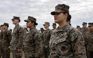 Cpl. Natalie Marino and other members of the 31st Marine Expeditionary Unit stand at attention during the opening ceremony for the Iron Fist exercise at Camp Ainoura in Sasebo, Japan, Feb. 25, 2024. 