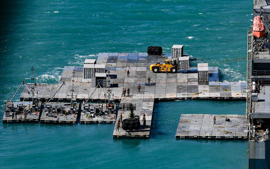 Army mariners work to construct a causeway known as Joint Logistics Over-the-Shore, or JLOTS, off the coast of Bowen, Australia, in 2023. U.S. officials plan to use JLOTS in the coming weeks to move aid into war-torn Gaza.