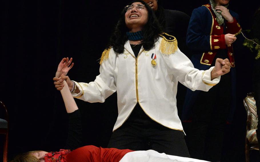 Romeo, played by Zama Middle-High School senior Justin Iriarte, laments the death of Juliet, played by fellow Zama senior Mia Perusich, during the one-act play "Romeo and Juliet: Six Very Busy Days," at the Far East Drama Festival on Camp Humphreys, South Korea, Feb. 9, 2023.