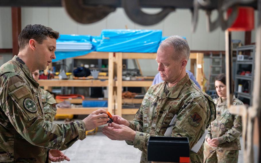 U.S. Air Force Gen. Mark Kelly, commander of Air Combat Command, right, participates in a demonstration with Task Force 99 airmen at Al Udeid Air Base, Qatar, Feb. 11, 2023.