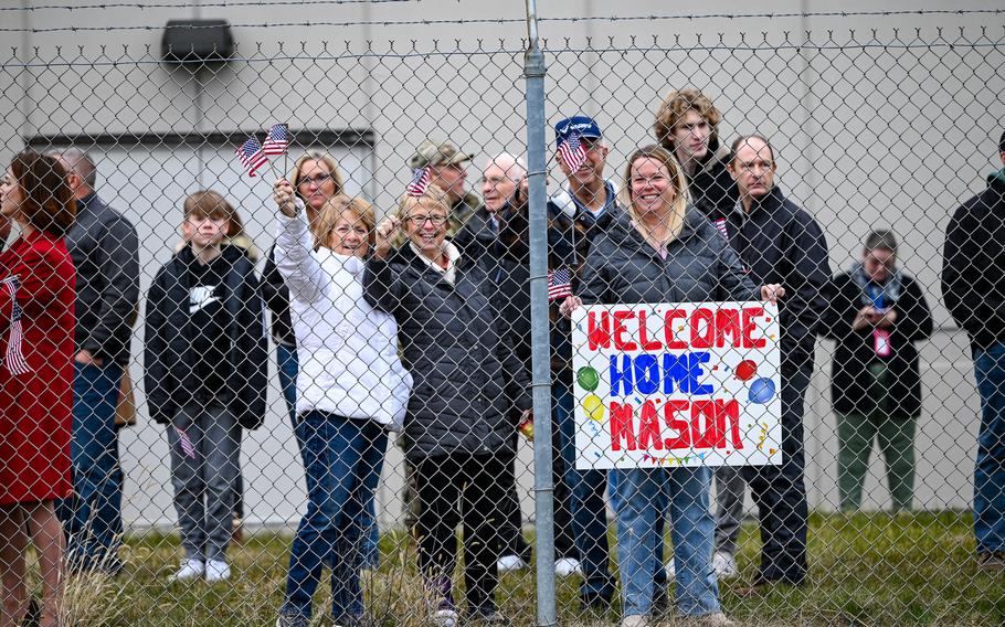 Family and friends wait to welcome home 445th Airlift Wing airmen at Wright-Patterson Air Force Base, Ohio, Jan. 4, 2024. 