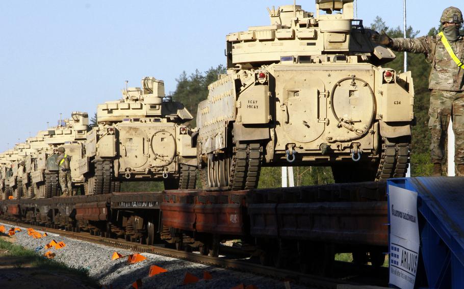 U.S. Army Sgt. Ian Ortiz guides a Bradley Fighting Vehicle onto a rail car in Pazeimene, Lithuania, in 2020. At a security conference in Bratislava, Slovakia, on May 30, 2023, retired Lt. Gen. Ben Hodges, a former U.S. Army Europe commander, said the U.S. and its NATO allies are not ready to defend the Continent in the event of a Russian attack.