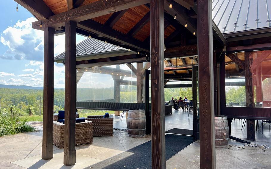 Cana Vineyard’s timber-frame Sunset Pavilion tasting room offers sweeping views of its hillside vineyards and the rolling Bull Run Mountains. 
