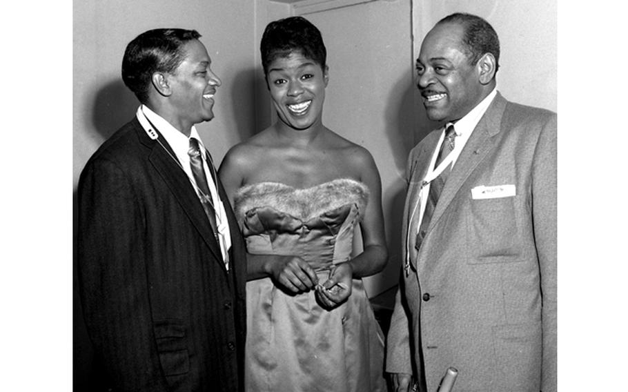 "Jazz audiences over here are crazy," said Sarah Vaughan as she toured Europe with tenor saxophonists Illinois Jacquet (left) and Coleman Hawkins. "I told them that in Paris — and I had to explain that in jazz jargon 'crazy' means wonderful. That's just what they are — wonderful."