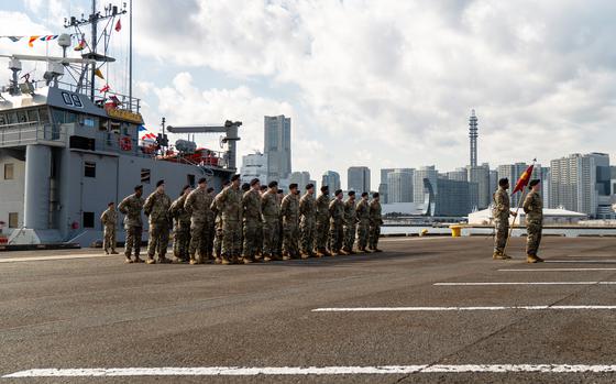 Soldiers stand in formation during an activation ceremony for the 5th Transportation Company at Yokohama North Dock, Japan, Thursday, Feb. 8, 2023. 