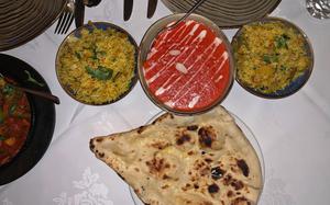 A sweet chicken tikka masala, bracketed by rice and naan, at Spice Lounge in Mildenhall, England. 