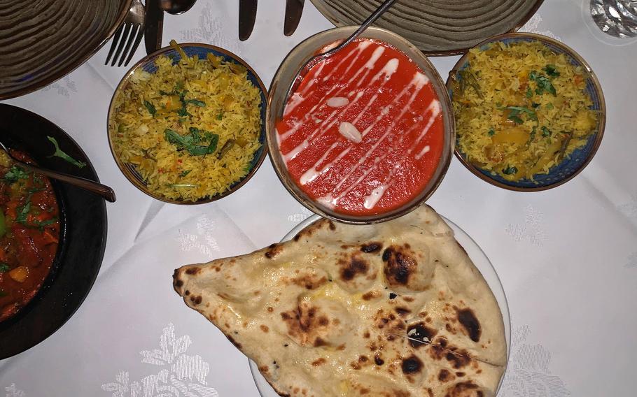 A sweet chicken tikka masala, bracketed by rice and naan, at Spice Lounge in Mildenhall, England. 