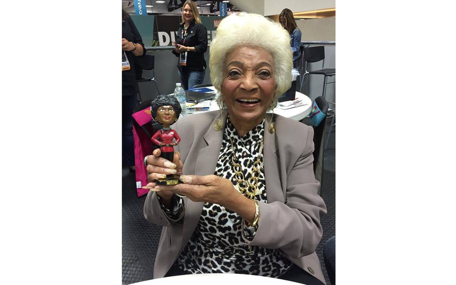 Nichelle Nicols with an Uhura bobblehead at San Diego Comic-Con International in 2016.