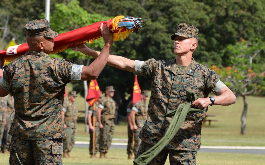 Marines uncase the colors of 3rd Marine Littoral Regiment during a ceremony at Marine Corps Base Hawaii, Thursday, March 3, 2022.