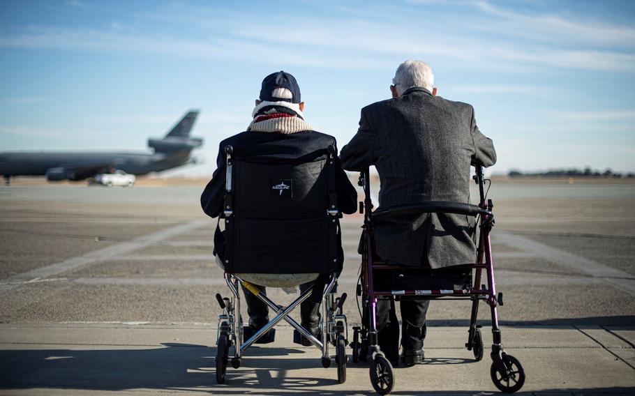 Dean “Diz” Laird, a World War II pilot famous for confirming kills in both the European and Pacific Theater, left, and Clarence “Bud” Anderson, three-time World War II flying ace, watch as a KC-10 Extender is taxied Nov. 10, 2020, at Travis Air Force Base, California. At 99 and 98, respectively, Laird and Anderson were high school students together in Auburn, Calif.