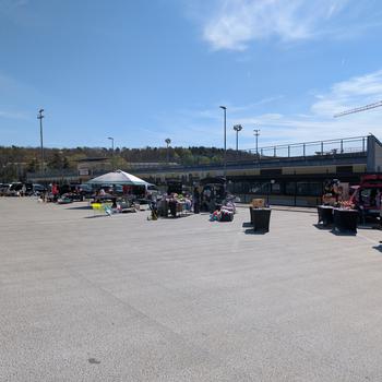 Row of vendors outside on a sunny day