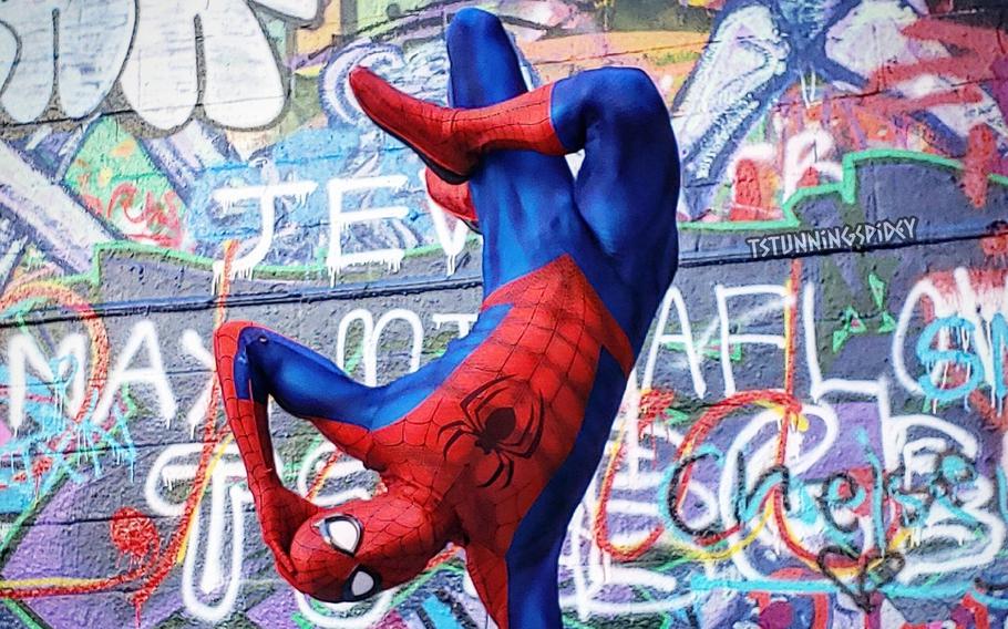 Tyler Scott Hoover, a professional Spider-Man cosplayer and model, is pictured in the classic costume of the Marvel comic superhero. 