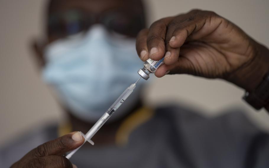 A health worker administers a dose of Janssen COVID-19 vaccine by Johnson & Johnson in the Medina neighborhood in Dakar, Senegal, July 28, 2021.