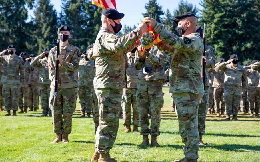 Col. David Pasquale and Command Sgt. Maj. Patrick Whitetree case the 2nd Infantry Division Artillery colors at Joint Base Lewis-McChord, Wash., Sept. 8, 2021. The unit is relocating to Camp Humphreys, South Korea. 