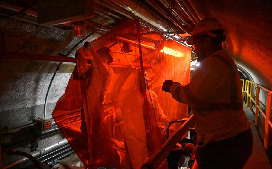 Personnel in support of Joint Task Force-Red Hill set up protective curtains prior to cutting into pipe lines at the Red Hill Bulk Fuel Storage Facility, Halawa, Hawaii, March 11, 2024.